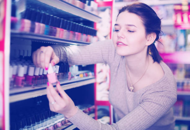 istock Pretty female searching for reliable nail polish 664979956