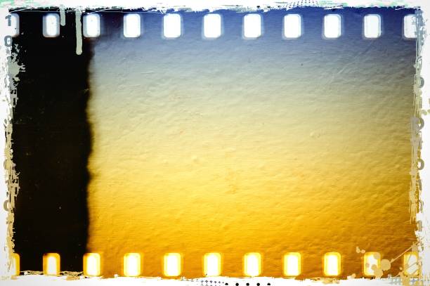 istock Vintage blue and sepia film strip frame with worn borders. Plaster textured. 664980532