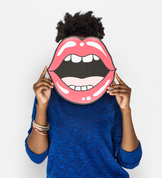 African Woman holding Peper Mouth Over her Face