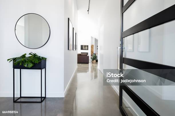 Contemporary Home Entry Hall With Polished Floors Stock Photo - Download Image Now - Entrance Hall, Corridor, House