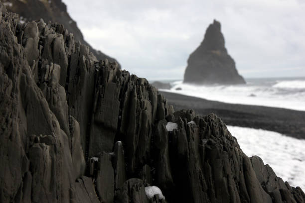 istock Black basalt stones by the arctic sea 664990780