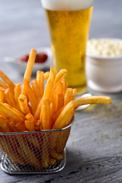 french fries, beer, mayonnaise and ketchup