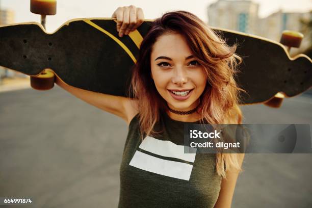 Beautiful Young Tattooed Girl With Longboard In Sunny Weather Stock Photo - Download Image Now