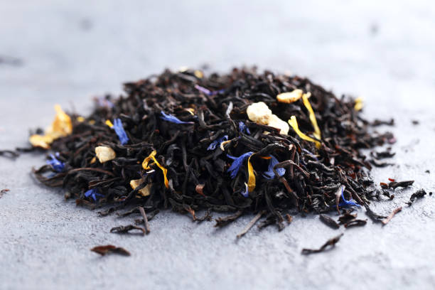 istock Heap of dry tea on grey table 664994480