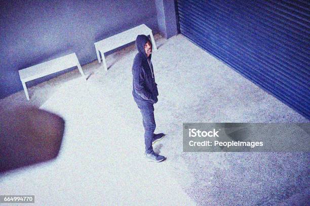 Hes Got Crime On His Mind Stock Photo - Download Image Now - Security Camera, Suspicion, Surveillance