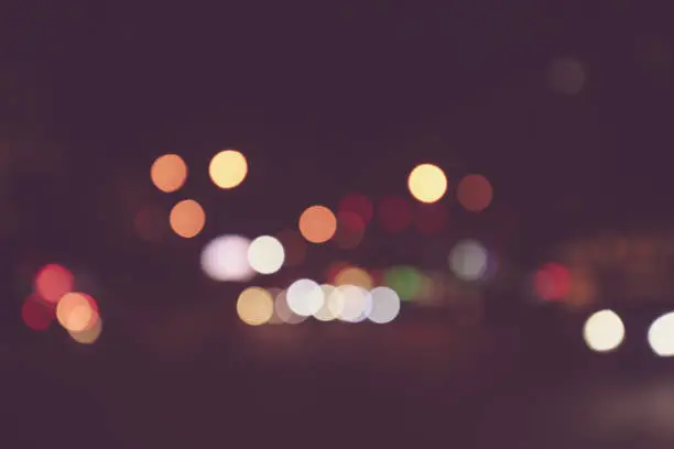 Blurry night streetlights background.