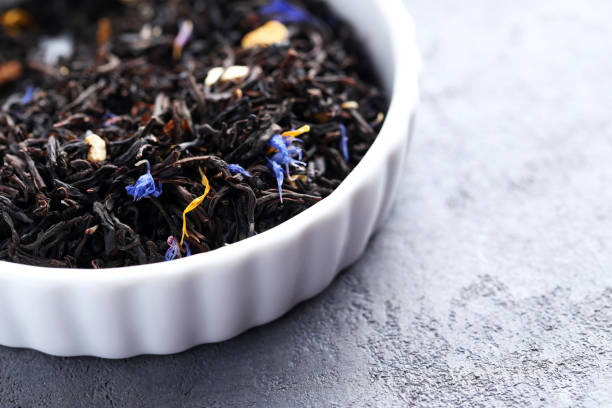 istock Heap of dry tea on grey table 664995848