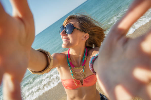 istock Cute girl enjoying on a sunny beach. 664998242