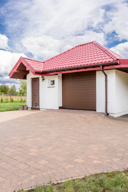istock Cobblestone driveway to a beautiful house idea 665001516