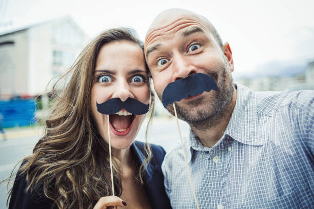 istock Young attractive couple making selfie 665001580
