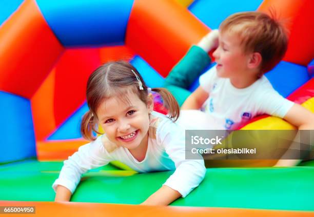 Happy Kids Having Fun On Playground In Kindergarten Stock Photo - Download Image Now