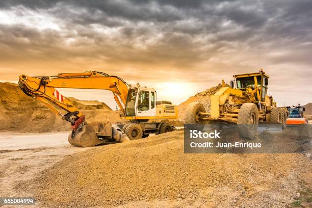 Outdoor Mine With Heavy Machinery Earthmoving And Rock Excavators Stock Photo - Download Image Now