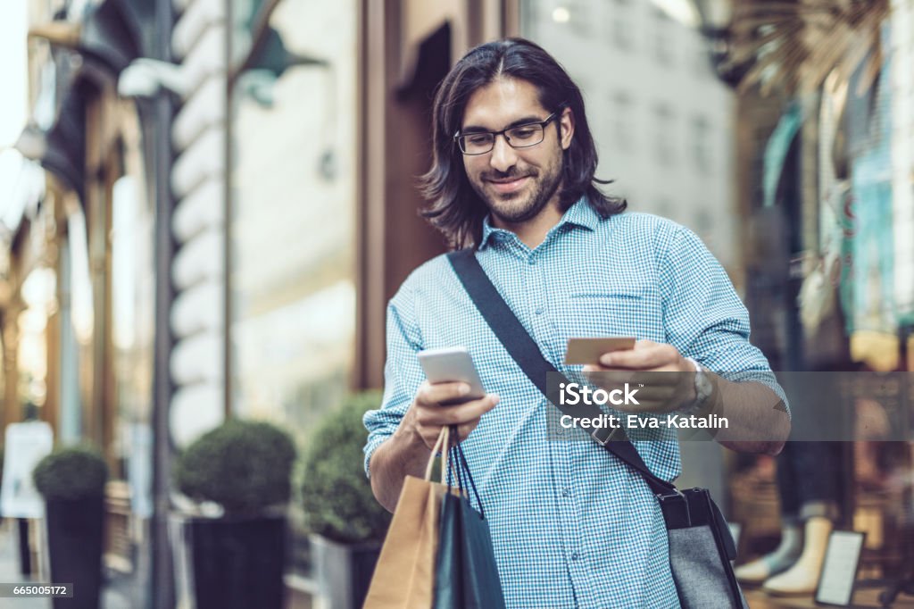 Young businessman shopping in the city Men Stock Photo