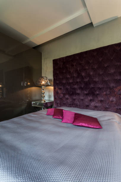 istock Dark bedroom with kingsize bed 665005750