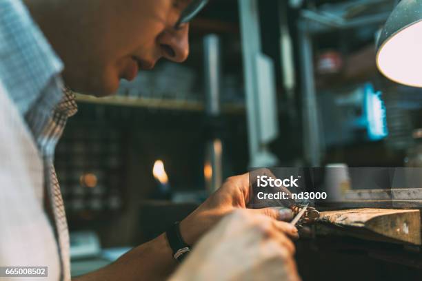 Jeweler Polishing Jewelry With Tools Stock Photo - Download Image Now - Anvil, Blacksmith, Bottling Plant