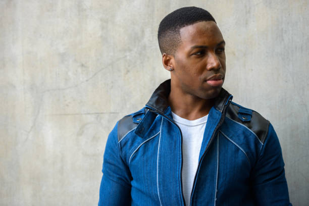 istock Close up of young handsome African man thinking while looking to the side 665009066
