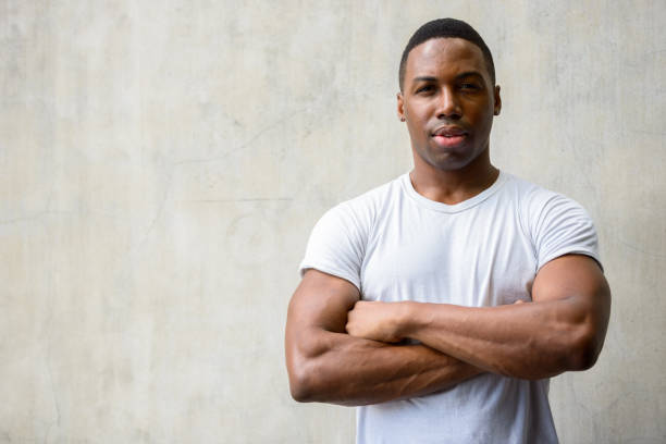 istock Young handsome African man with arms crossed 665009236