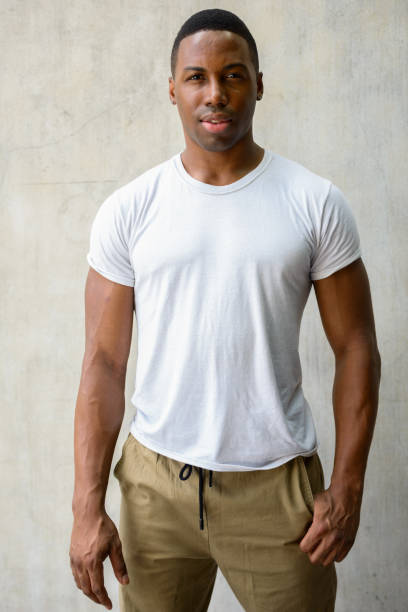istock Young handsome African man against concrete wall 665009276