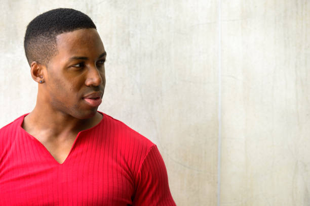 istock Close up of young handsome African man thinking while looking away 665009498