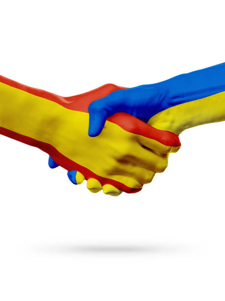 istock Flags Spain, Ukraine countries, partnership friendship handshake concept. 665009508