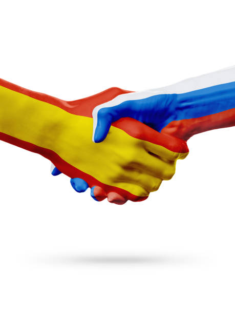 istock Flags Spain, Russia countries, partnership friendship handshake concept. 665009802