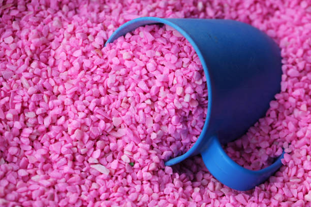 istock pink decoration stone with measuring plastic bowl as background. 665013162