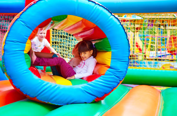 istock happy kids, having fun on inflatable attraction playground 665013626