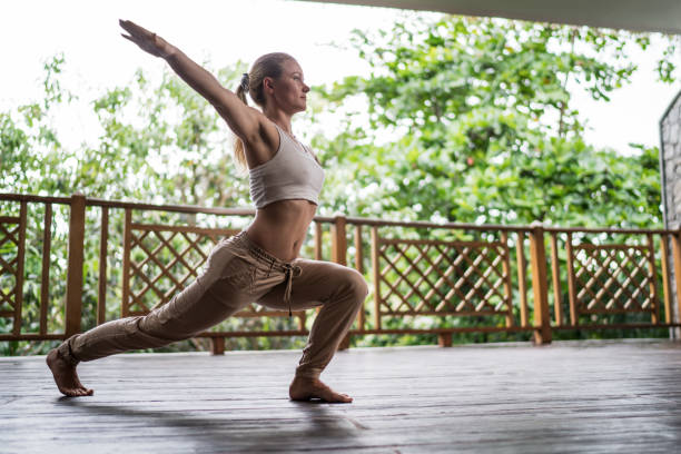 istock Woman stretching with her arms outstretched on a terrace. 665013678