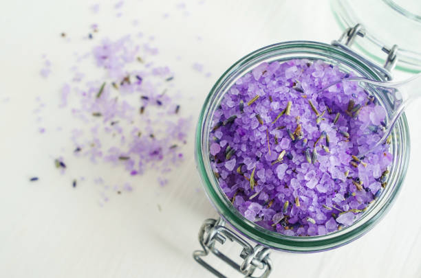 istock Aroma bath salt with lavender extract and dried lavender (top view, close up, copy space). 665017126