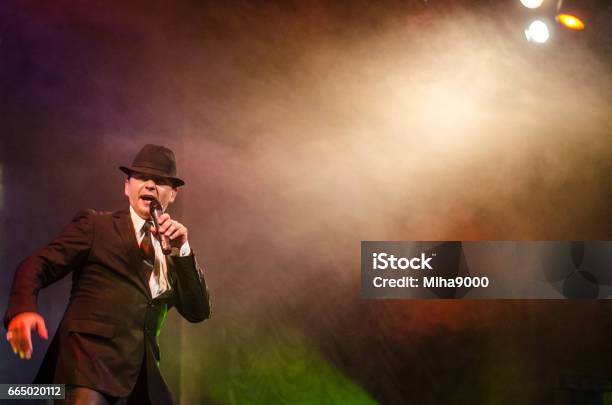 Oldfashioned Man On Stage Looking Tough Stock Photo - Download Image Now - Adult, Adults Only, Back Lit