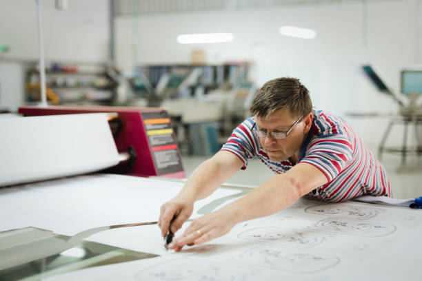 istock Professional industrial clothing designer working according to scheme 665020862