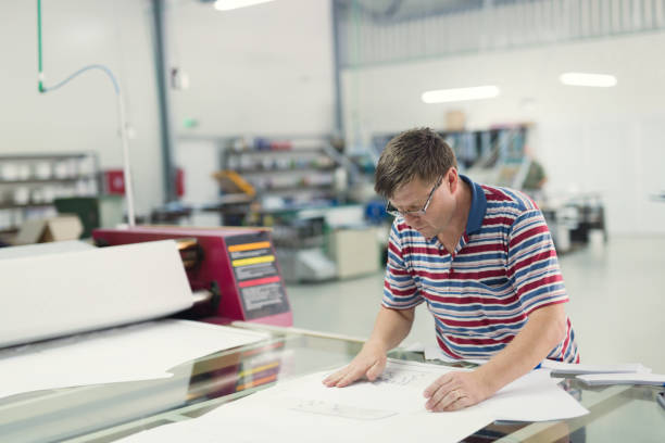 istock Professional industrial clothing designer working according to scheme 665020954
