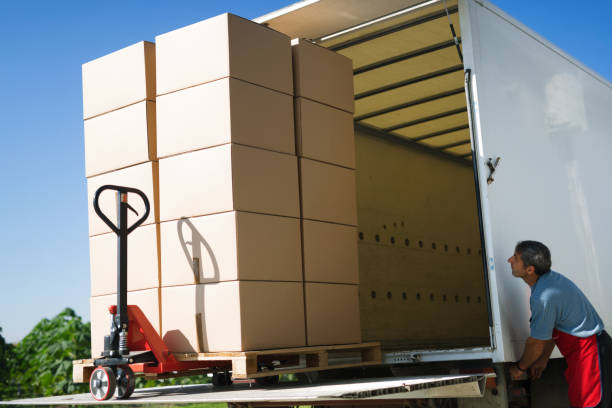 istock Cargo and goods transportation by truck carrying boxes 665023340