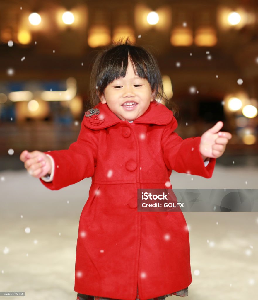 Close up Little girl wearing a red jacket. Close up Little girl wearing a red jacket has a fun in snow, Winter time. Child Stock Photo