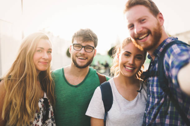 istock Young happy students taking selfie and laughing 665031350