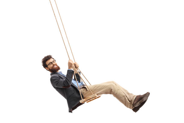 istock Bearded man swinging on a swing 665035194