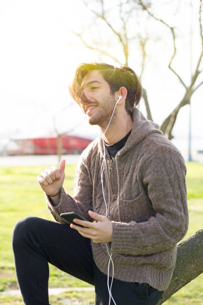 istock Young Man listenning music on smartphone 665035208