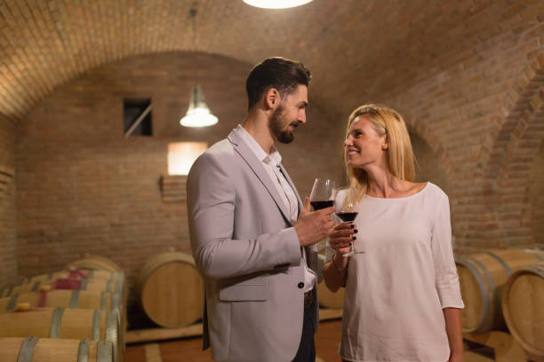 istock Wine loving couple tasting wines in winery cellar 665035460