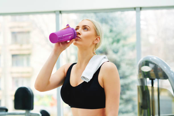 istock Attractive woman exercising at gym 665035526