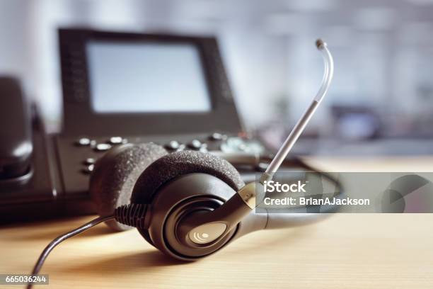 Headset Headphones And Telephone In Call Center Stock Photo - Download Image Now - Call Center, Headset, Hands-free Device