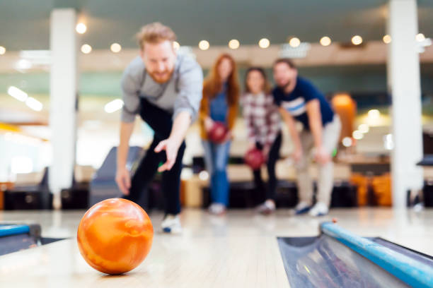 istock Friends bowling at club and having fun playing casually 665037968