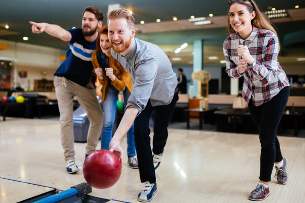 istock Friends bowling and enjoying moments together 665038678