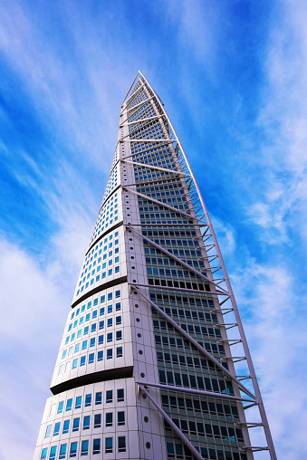 MALMO, SWEDEN - MARCH 07, 2017: Low angle view of Malmo Sweden skyscraper Turning Torso, regarded as the first twisted skyscraper in the world.