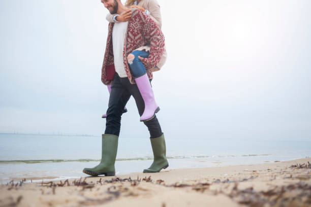 istock Couple walking at the beach 665051994