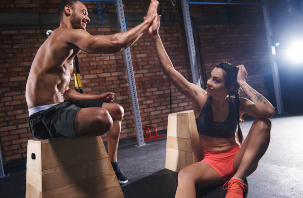 istock Sporty couple high five at gym 665056318