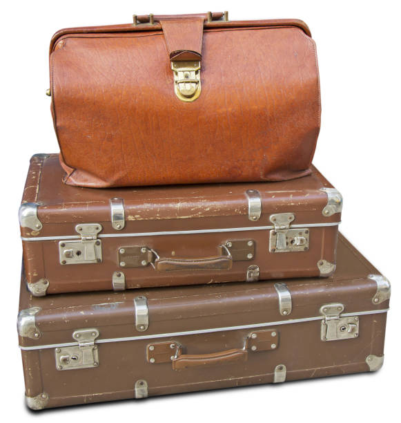 istock Old leather bag and two old suitcases 665064308