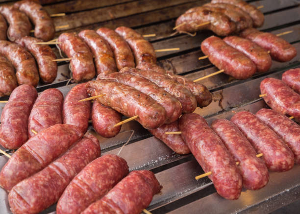 istock Cooking sausage at barbecue 665072722
