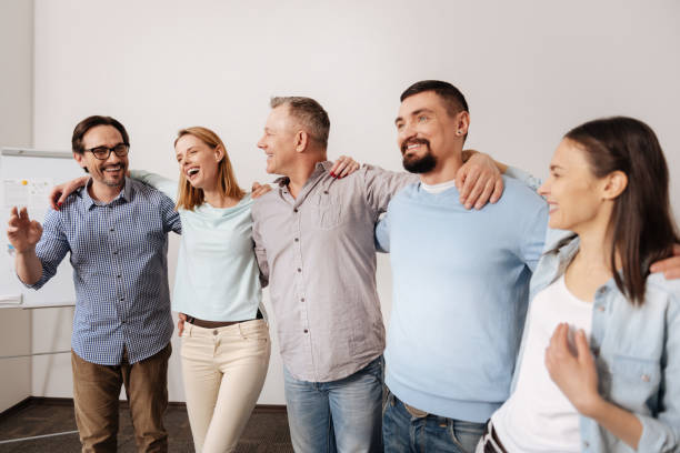 istock Positive delighted team standing in line 665077048