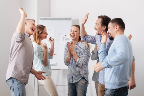 istock Happy woman standing between her colleagues 665084930