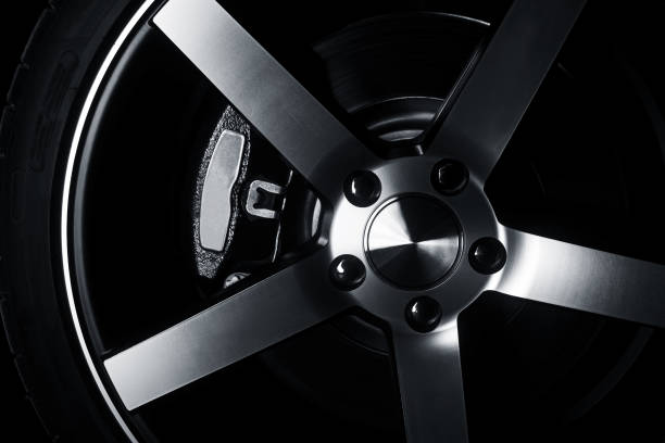 istock Modern metal rims on car at dark 665086368